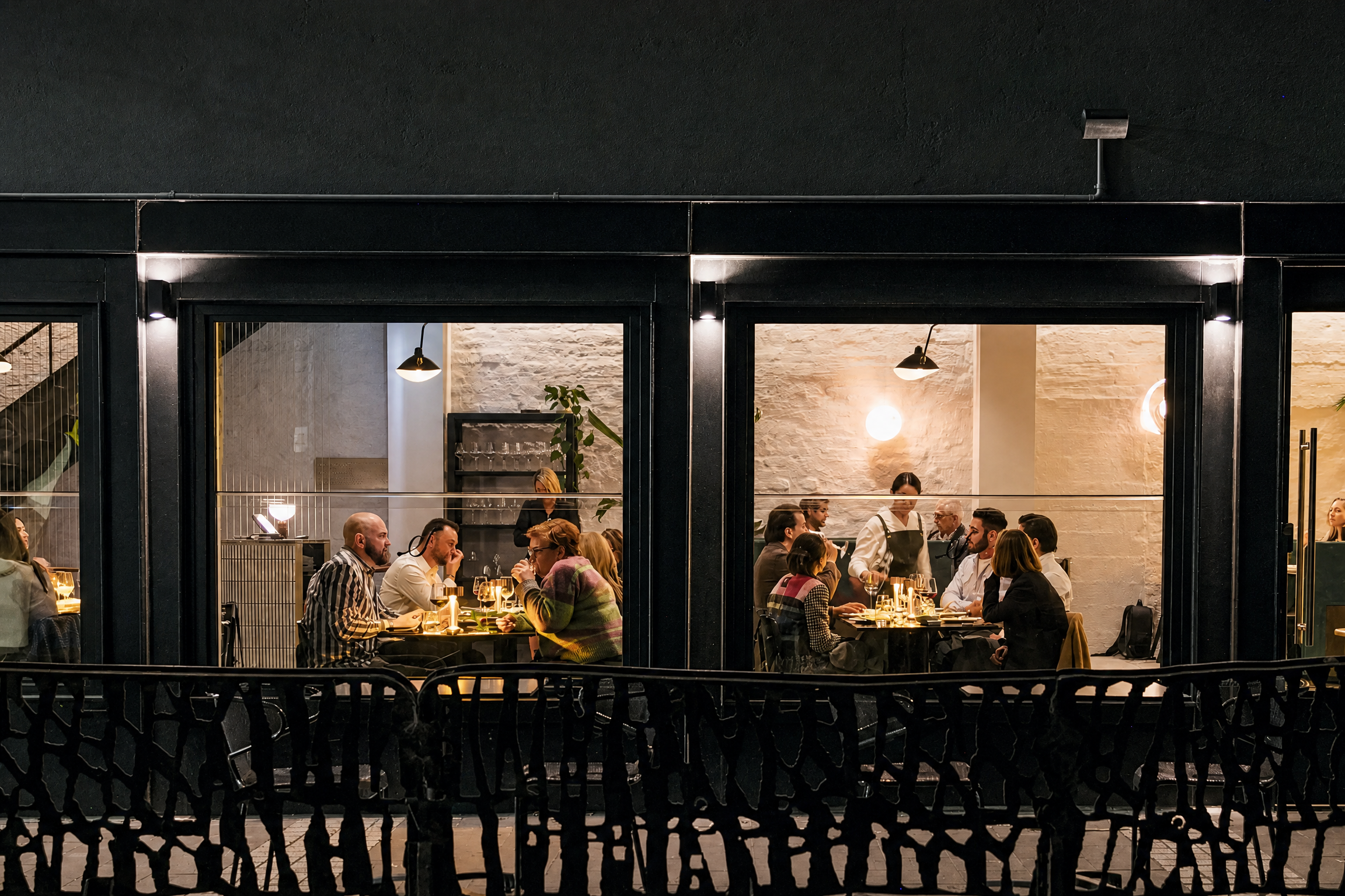 Guests dining inside Stella on an evening in South Yarra