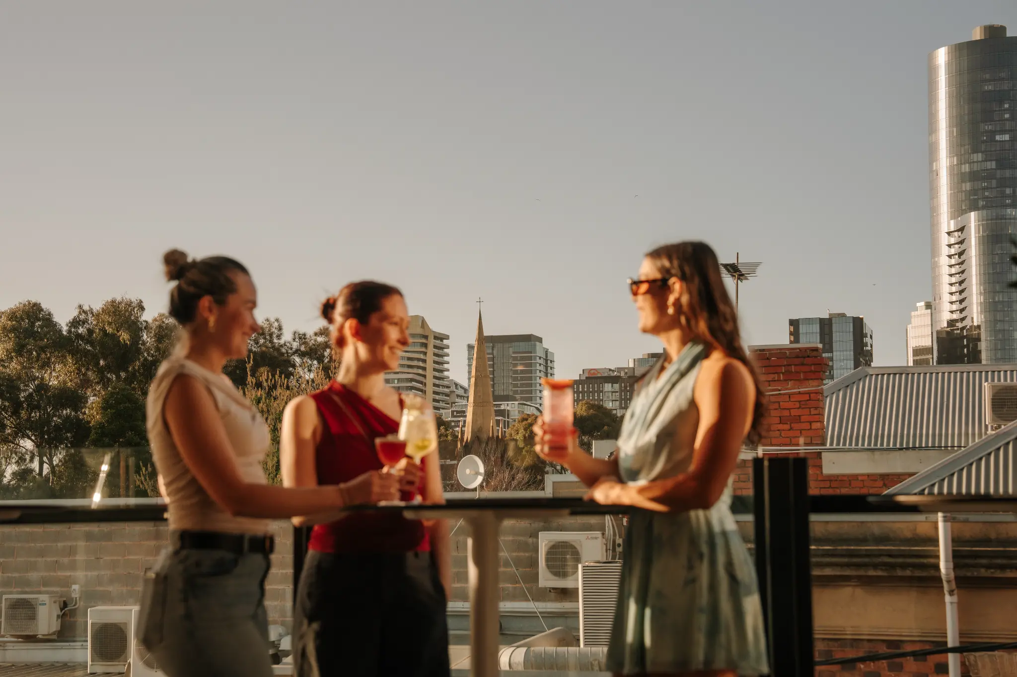 Guests enjoying drinks at sunset on Stella Rooftop in South Yarra